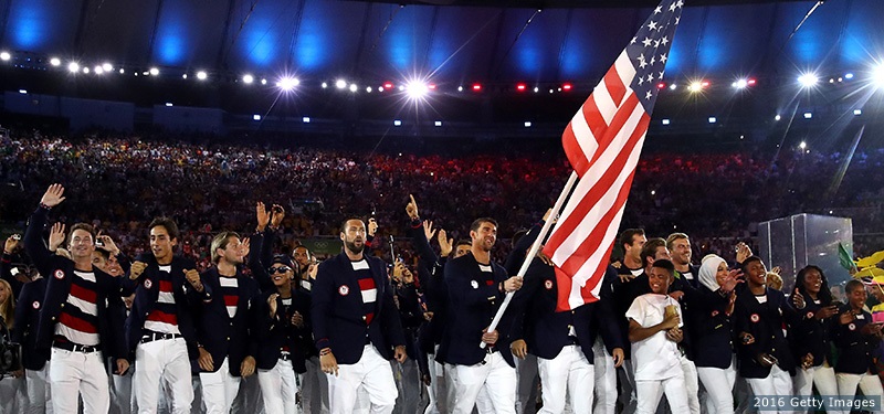 RIO DE JANEIRO, BRAZIL - AUGUST 05: Michael Phelps of the United States carries the flag during the Opening Ceremony of the Rio 2016 Olympic Games at Maracana Stadium on August 5, 2016 in Rio de Janeiro, Brazil. (Photo by Cameron Spencer/Getty Images)